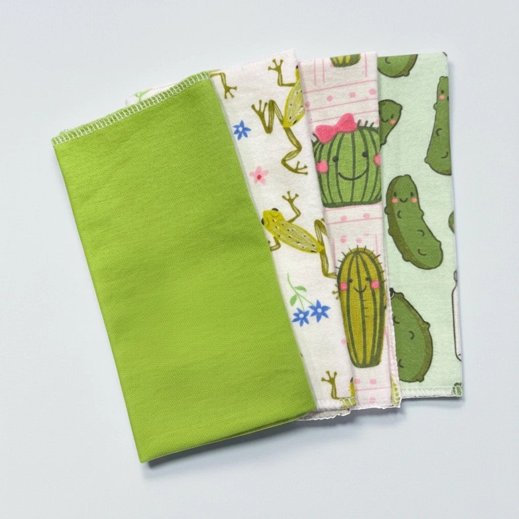 Crafts by Serenity mystery bundle of 12 eco-friendly reusable paper towels with assorted fun patterns and solid green.