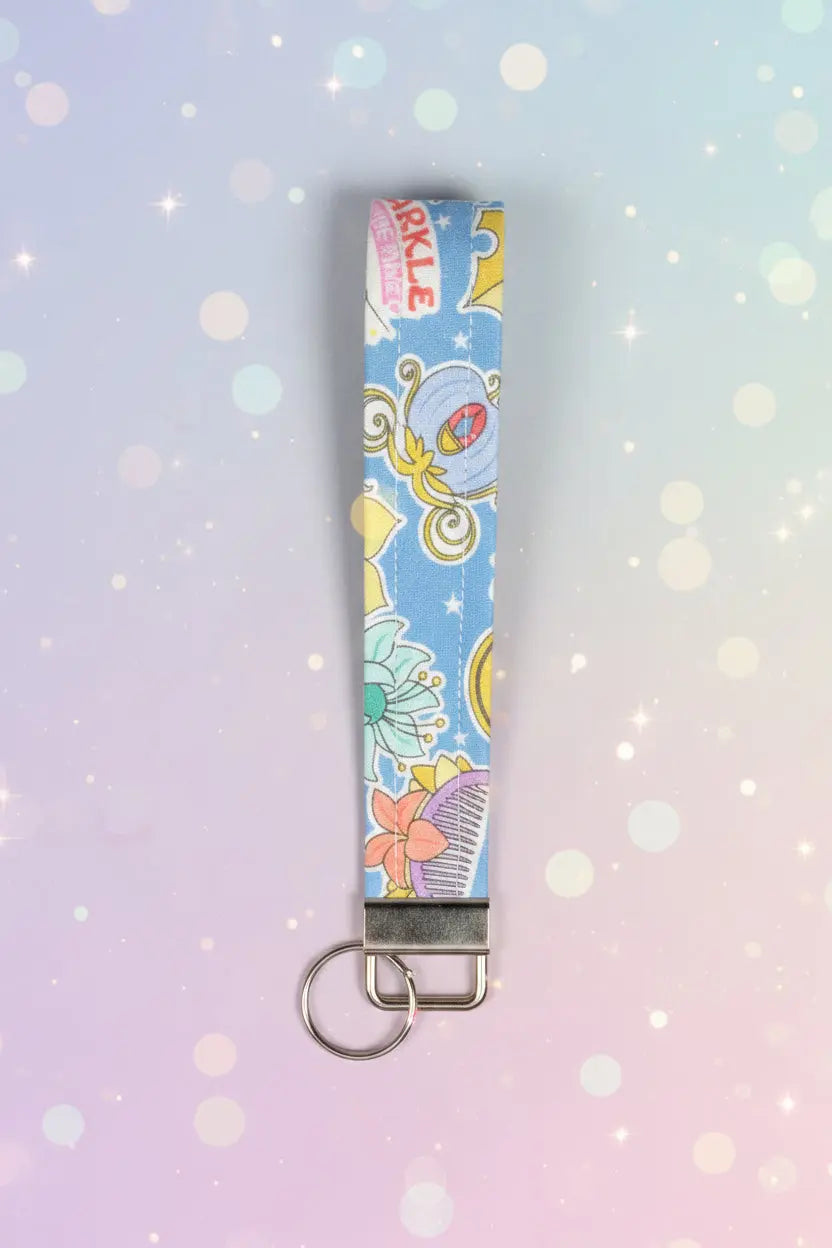 Colorful keychain with cartoon designs on a blue background