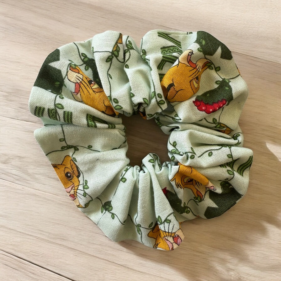 Scrunchie with cartoon animal design on a wooden surface