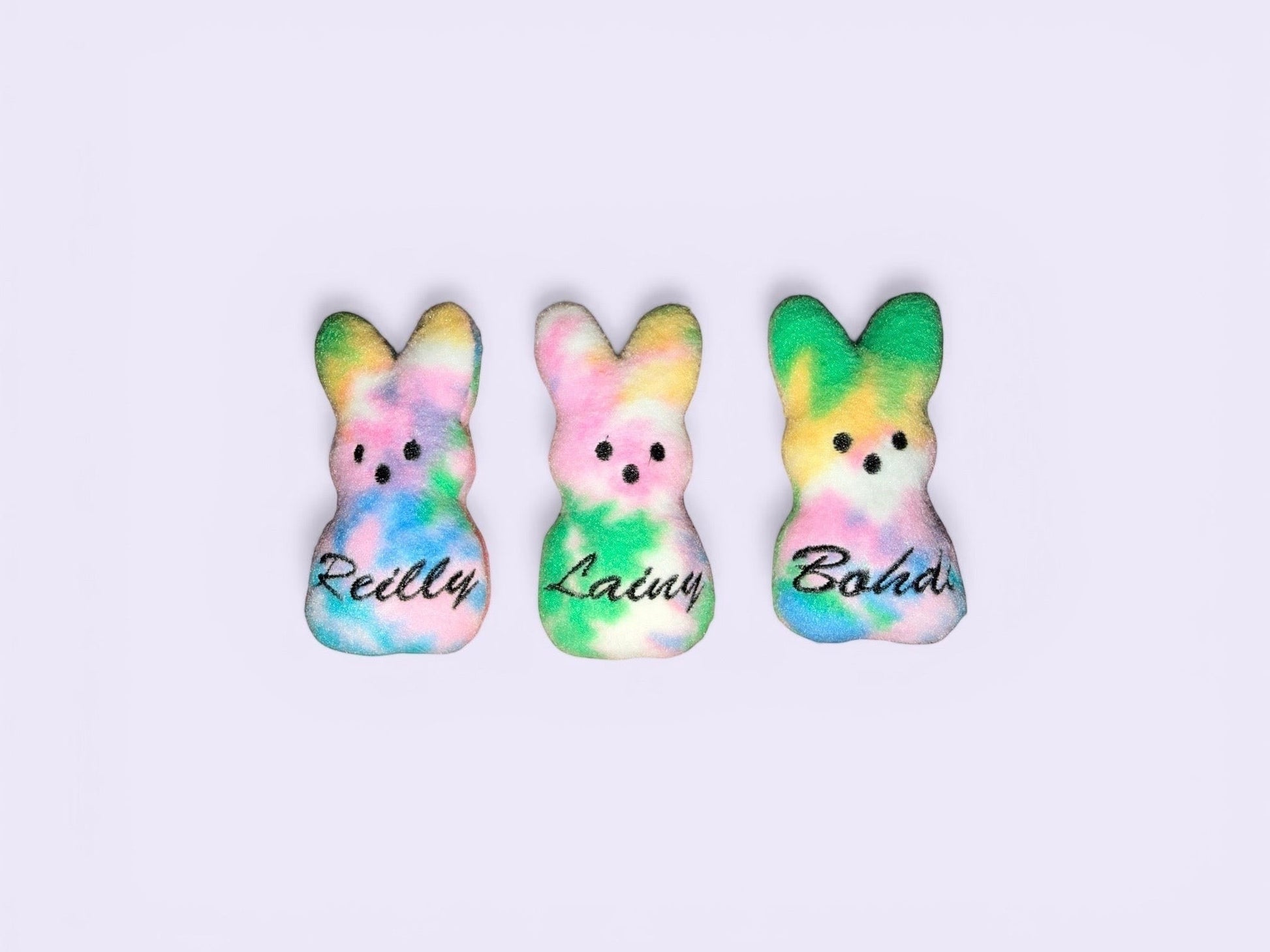 Crafts by Serenity personalized tie-dye plush bunny keepsakes with custom names, perfect for Easter gifts.