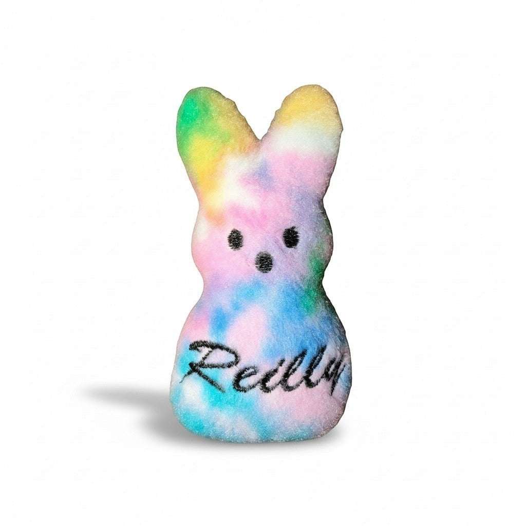 Crafts by Serenity personalized tie-dye plush bunny keepsake with embroidered name on soft fabric.